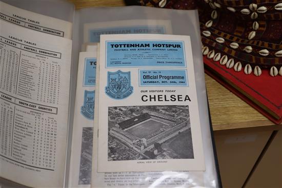 A large collection of Tottenham Hotspur memorabilia including programmes, official season handbooks, ticket stubs and a rattle,